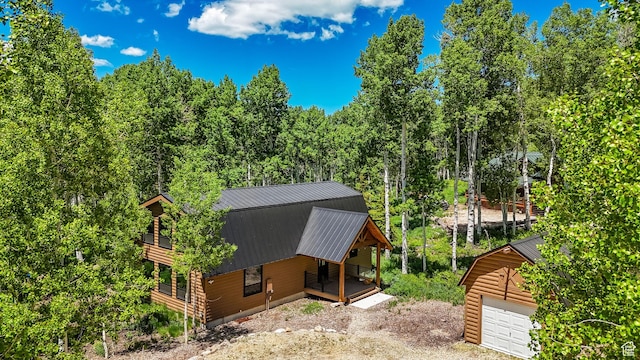 11249 E Columbine Ln Unit 1607, Heber City, UT 84032 - view of property exterior with a porch, metal roof, a garage, driveway, and an outdoor structure