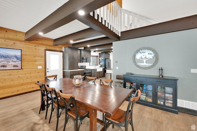 11249 E Columbine Ln Unit 1607, Heber City, UT 84032 - dining space featuring light wood finished floors, beamed ceiling, wood walls, and baseboards