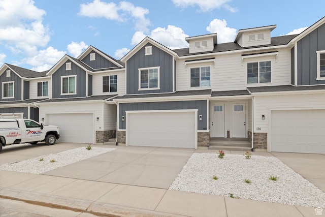 101 W 1360 N, Nephi, UT 84648 - view of property with a garage, stone siding, board and batten siding, and driveway