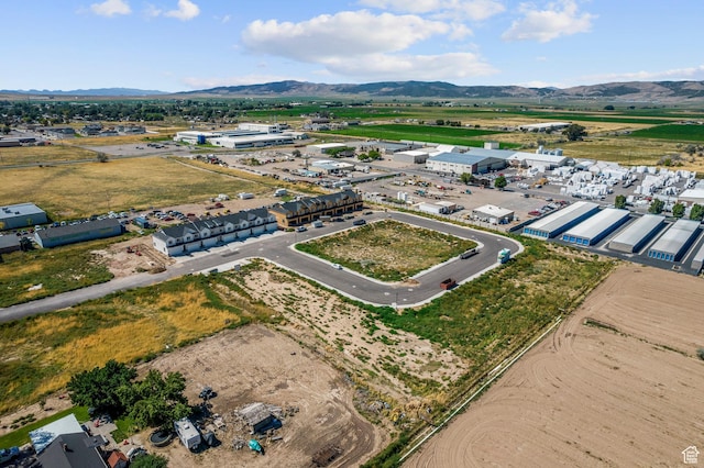 birds eye view of property with a mountain view
