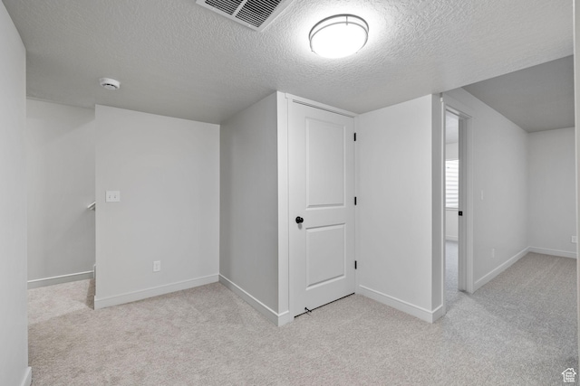 bonus room with carpet, visible vents, and baseboards