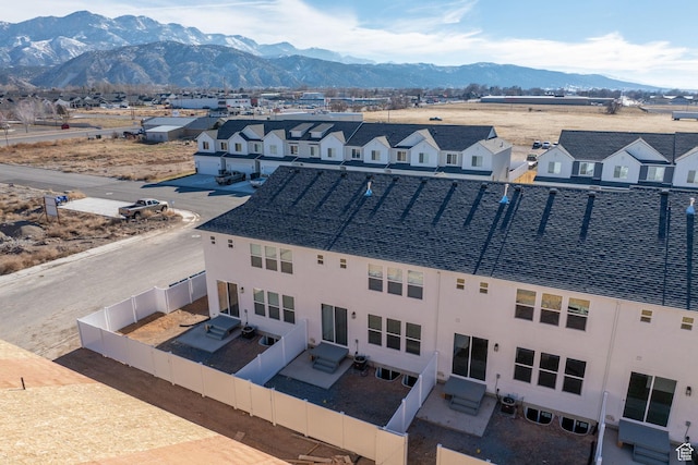drone / aerial view with a residential view and a mountain view