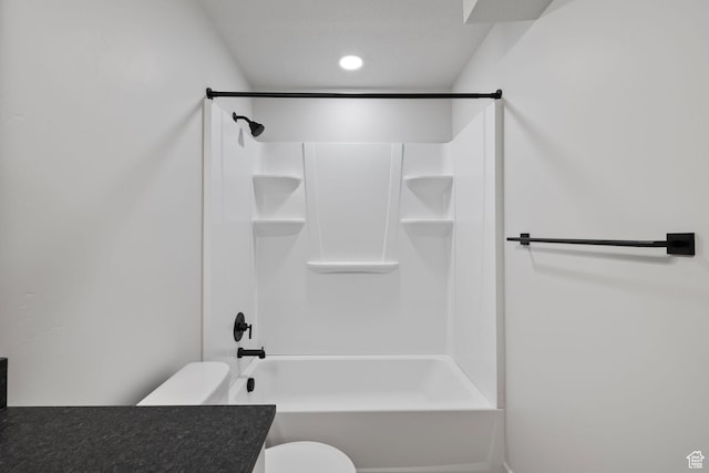 bathroom featuring shower / washtub combination, vanity, and toilet