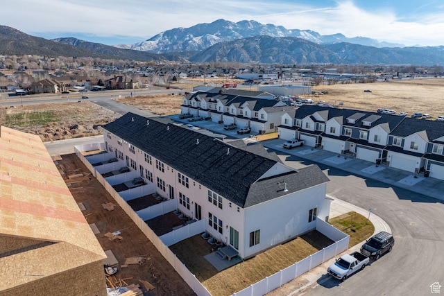 drone / aerial view with a residential view and a mountain view