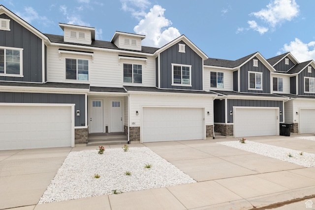 101 W 1360 N, Nephi, UT 84648 - multi unit property with board and batten siding, an attached garage, stone siding, and concrete driveway