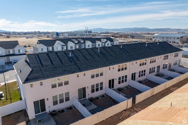 birds eye view of property with a mountain view