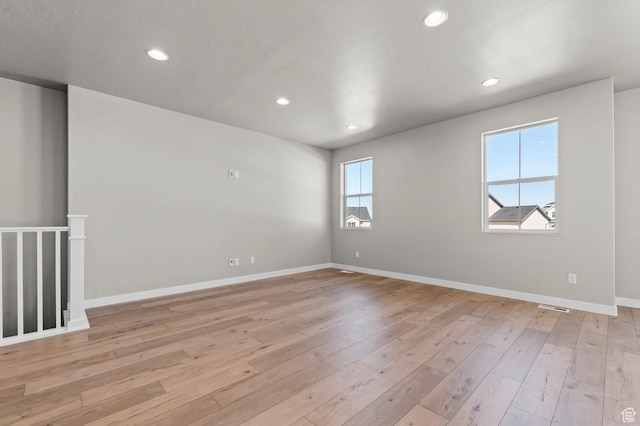 2571 N 3200 W, Clinton, UT 84015 - empty room featuring light wood-style flooring, recessed lighting, and baseboards