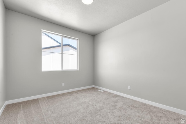 2571 N 3200 W, Clinton, UT 84015 - empty room featuring carpet, baseboards, and a textured ceiling