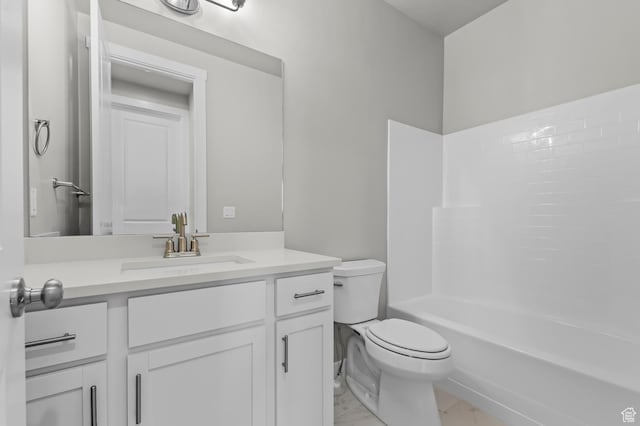 2571 N 3200 W, Clinton, UT 84015 - bathroom with toilet, vanity, marble finish floors, and washtub / shower combination