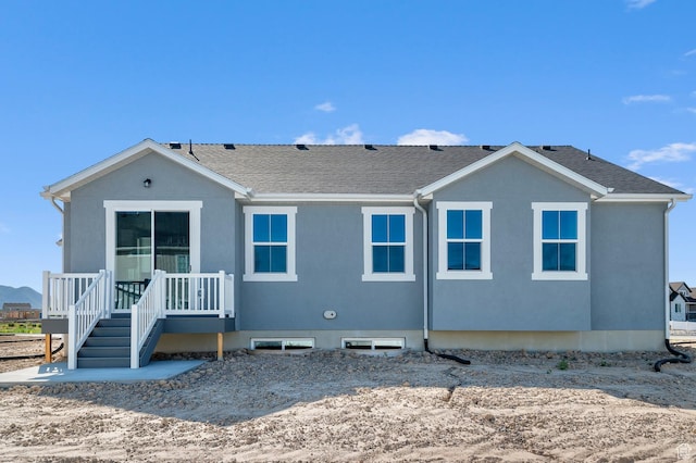 2571 N 3200 W, Clinton, UT 84015 - back of house featuring stucco siding and a shingled roof