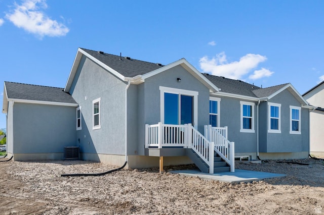 2571 N 3200 W, Clinton, UT 84015 - view of front facade featuring central AC and stucco siding