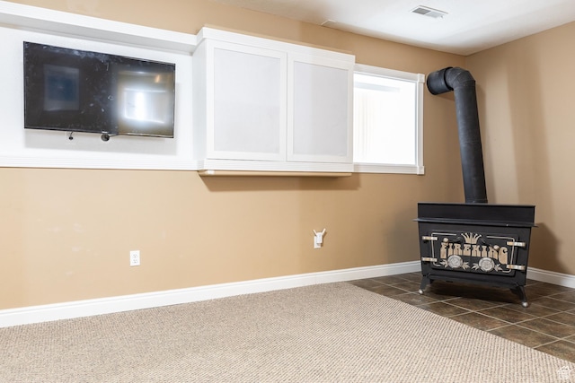 93 N 200 W, Smithfield, UT 84335 - details with visible vents, carpet, a wood stove, and baseboards