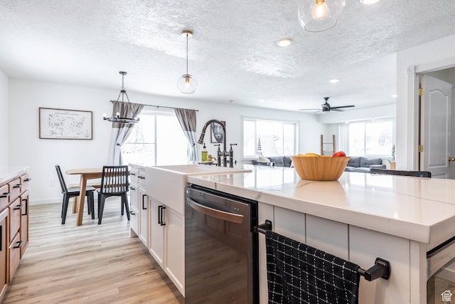 93 N 200 W, Smithfield, UT 84335 - kitchen with white cabinets, an island with sink, open floor plan, decorative light fixtures, and stainless steel dishwasher