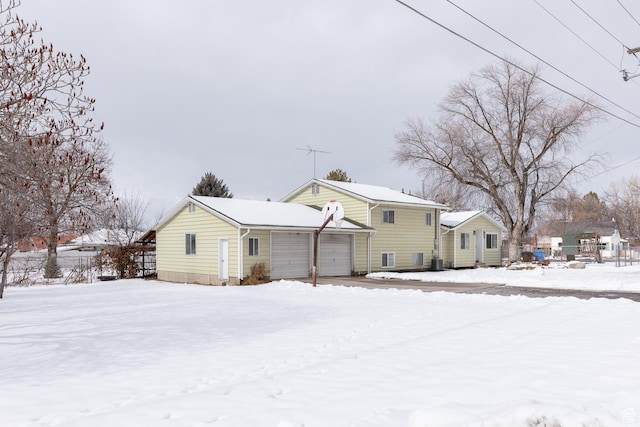 93 N 200 W, Smithfield, UT 84335 - snow covered rear of property featuring a garage