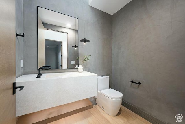 2655 W Shoshoni Trl, St George, UT 84770 - half bathroom featuring wood finished floors and toilet