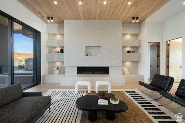 2655 W Shoshoni Trl, St George, UT 84770 - living room with a premium fireplace, wooden ceiling, light wood-style flooring, and recessed lighting