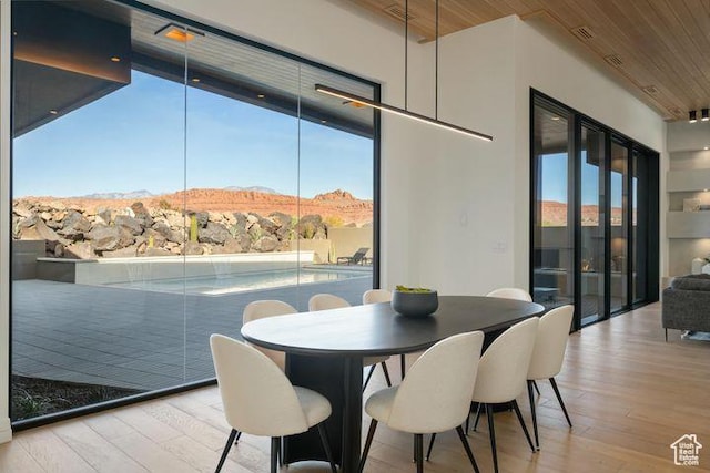 2655 W Shoshoni Trl, St George, UT 84770 - dining space with a wealth of natural light, wooden ceiling, a mountain view, and light wood-style floors