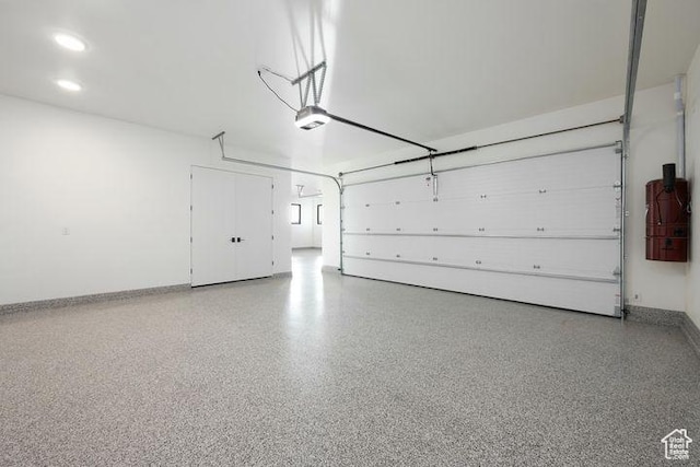2655 W Shoshoni Trl, St George, UT 84770 - garage featuring recessed lighting, baseboards, and a garage door opener
