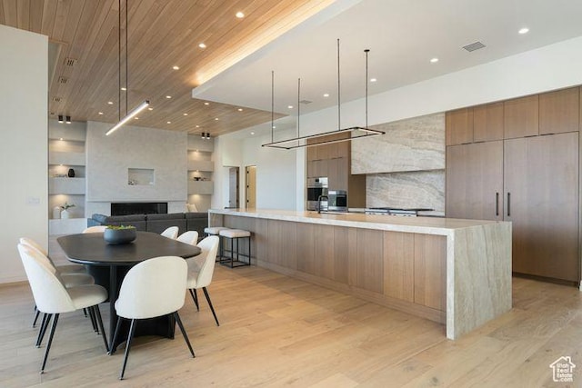 2655 W Shoshoni Trl, St George, UT 84770 - kitchen with wood ceiling, open floor plan, light countertops, and modern cabinets