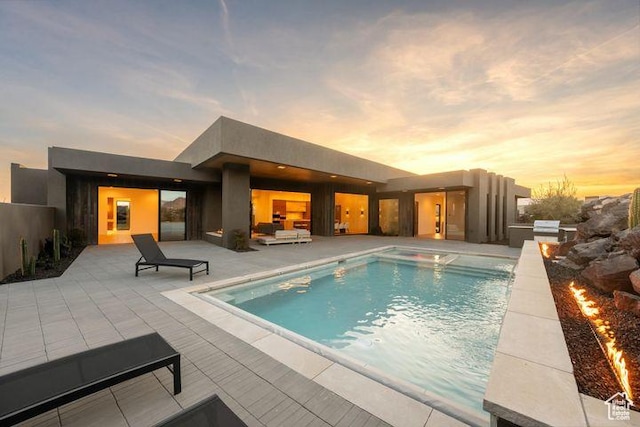 2655 W Shoshoni Trl, St George, UT 84770 - pool at dusk with a patio area and an outdoor pool