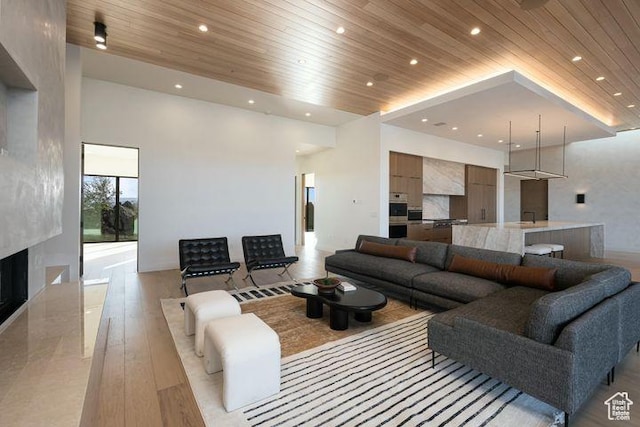 2655 W Shoshoni Trl, St George, UT 84770 - living area with recessed lighting, light wood-style floors, wood ceiling, and a high end fireplace