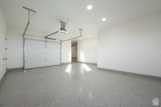 2655 W Shoshoni Trl, St George, UT 84770 - garage featuring a garage door opener and baseboards