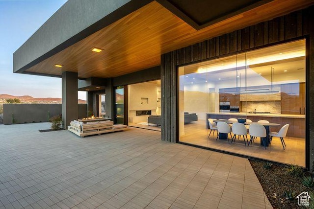 2655 W Shoshoni Trl, St George, UT 84770 - patio terrace at dusk featuring outdoor dining space