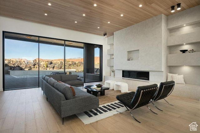 2655 W Shoshoni Trl, St George, UT 84770 - living area with wooden ceiling, a mountain view, recessed lighting, a premium fireplace, and light wood finished floors