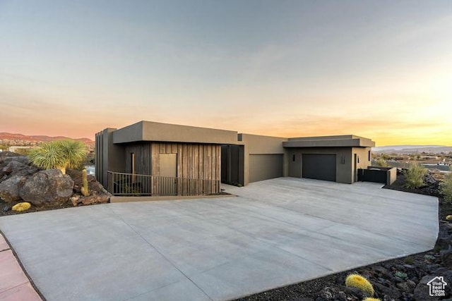 2655 W Shoshoni Trl, St George, UT 84770 - view of front of property with a detached garage and stucco siding