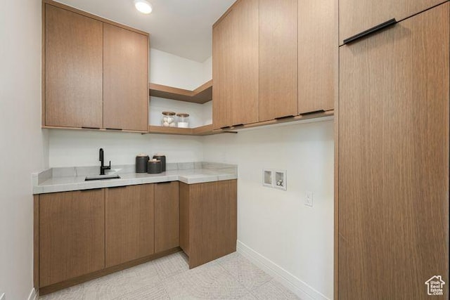 2655 W Shoshoni Trl, St George, UT 84770 - kitchen with light countertops, open shelves, a sink, and baseboards