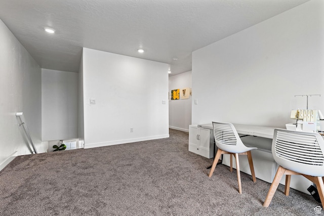 office space featuring recessed lighting, dark carpet, and baseboards