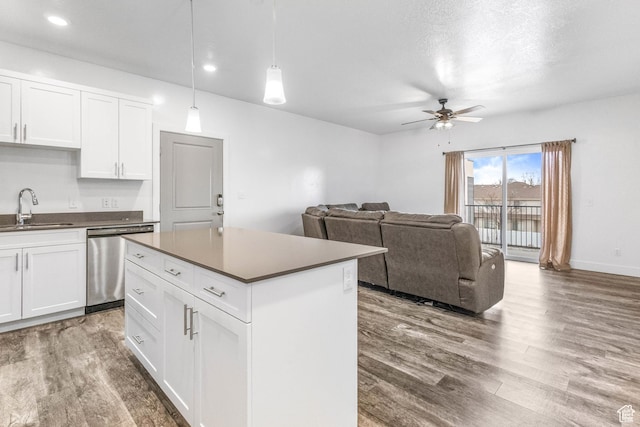 875 S Depot St Unit C316, Clearfield, UT 84015 - kitchen with a sink, white cabinetry, dishwasher, dark countertops, and decorative light fixtures