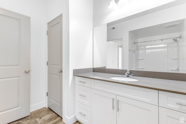 875 S Depot St Unit C316, Clearfield, UT 84015 - bathroom featuring wood finished floors, vanity, and baseboards