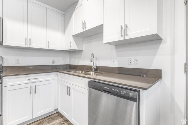 875 S Depot St Unit C316, Clearfield, UT 84015 - kitchen featuring dishwasher, dark countertops, a sink, and white cabinets