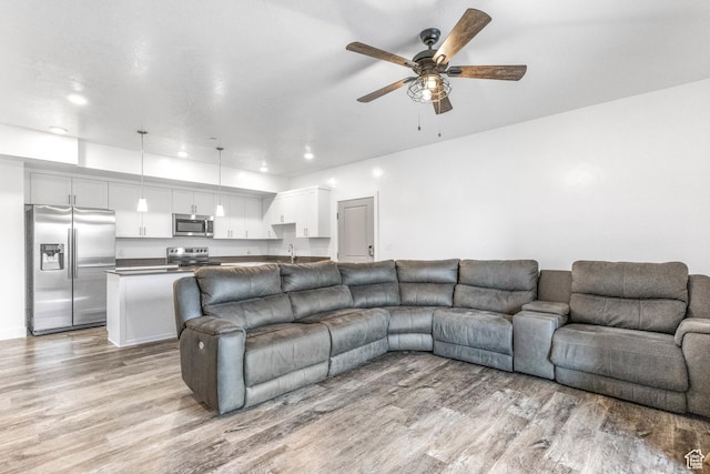 875 S Depot St Unit C316, Clearfield, UT 84015 - living area featuring ceiling fan, light wood finished floors, and recessed lighting