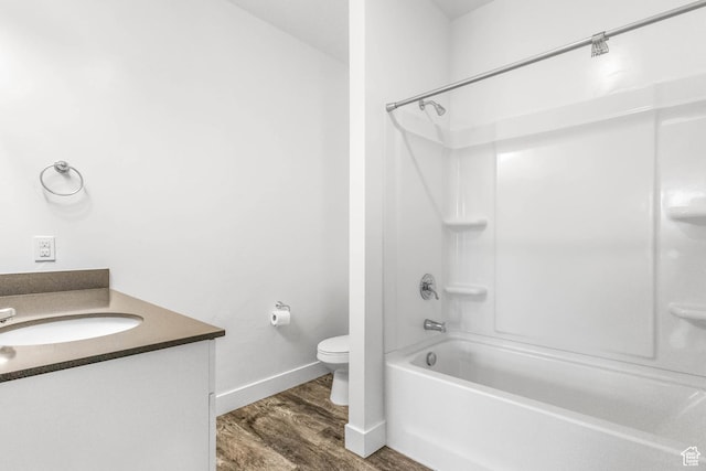 875 S Depot St Unit C316, Clearfield, UT 84015 - bathroom featuring baseboards, toilet, vanity, wood finished floors, and shower / bathtub combination