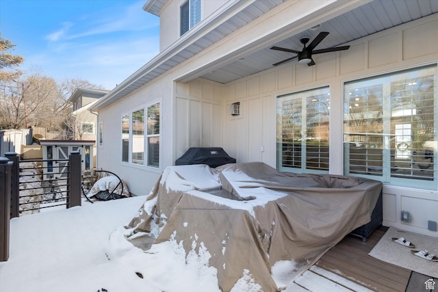 2321 E John Holladay Ct S, Holladay, UT 84117 - snow covered patio with a ceiling fan, an outbuilding, a wooden deck, and a shed