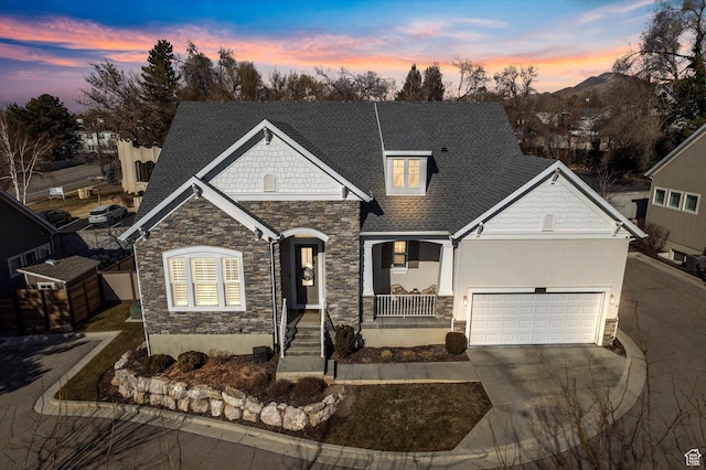 2321 E John Holladay Ct S, Holladay, UT 84117 - view of front facade featuring stucco siding, a porch, concrete driveway, a mountain view, and a garage