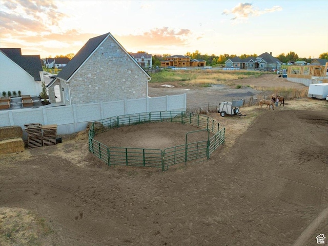 exterior space featuring a residential view and an enclosed area