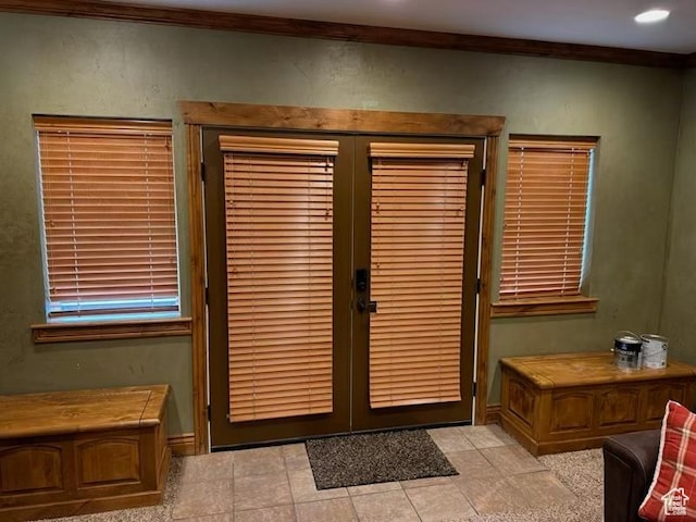 interior details featuring french doors, baseboards, and ornamental molding