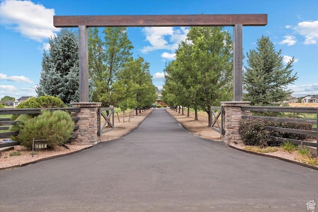 view of home's community with fence