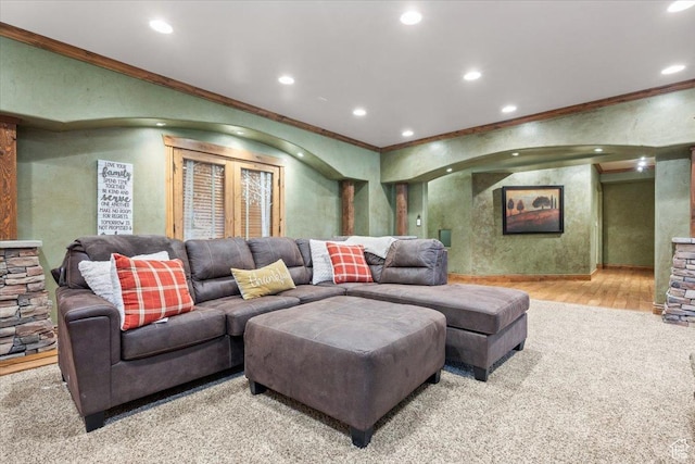 living room featuring crown molding, baseboards, recessed lighting, and wood finished floors