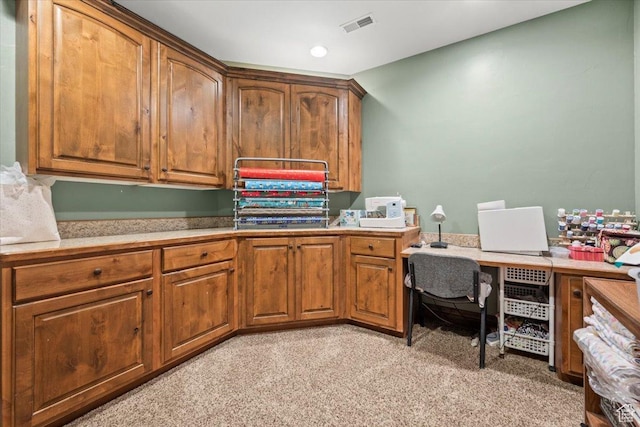 office area featuring light colored carpet and visible vents