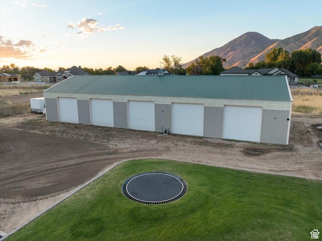 detached garage featuring a mountain view