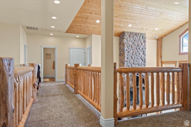 hall featuring visible vents, baseboards, wooden ceiling, carpet, and recessed lighting