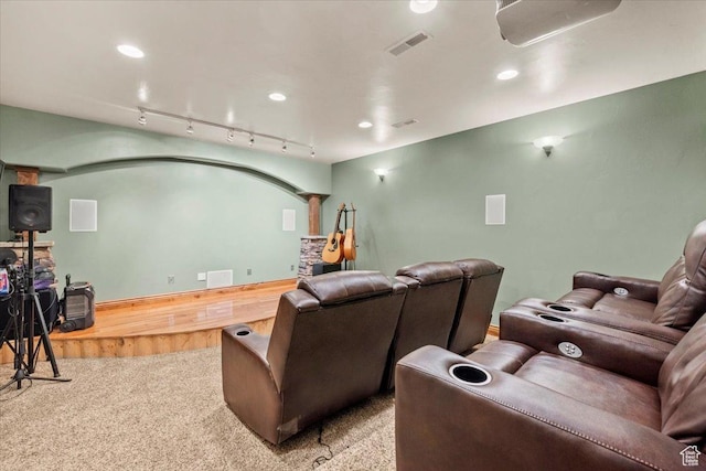 carpeted home theater with visible vents, rail lighting, and recessed lighting