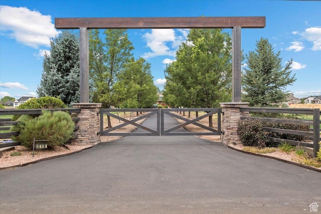 view of gate featuring fence