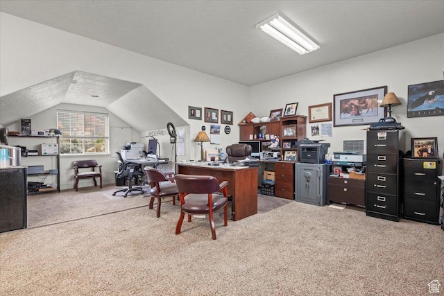carpeted office space featuring a textured ceiling and lofted ceiling