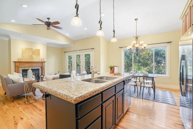 1429 E Chateau Ridge Way S, Sandy, UT 84092 - kitchen featuring appliances with stainless steel finishes, open floor plan, a kitchen island with sink, a sink, and vaulted ceiling