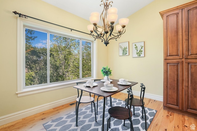 1429 E Chateau Ridge Way S, Sandy, UT 84092 - dining space with light wood-type flooring, a notable chandelier, and baseboards